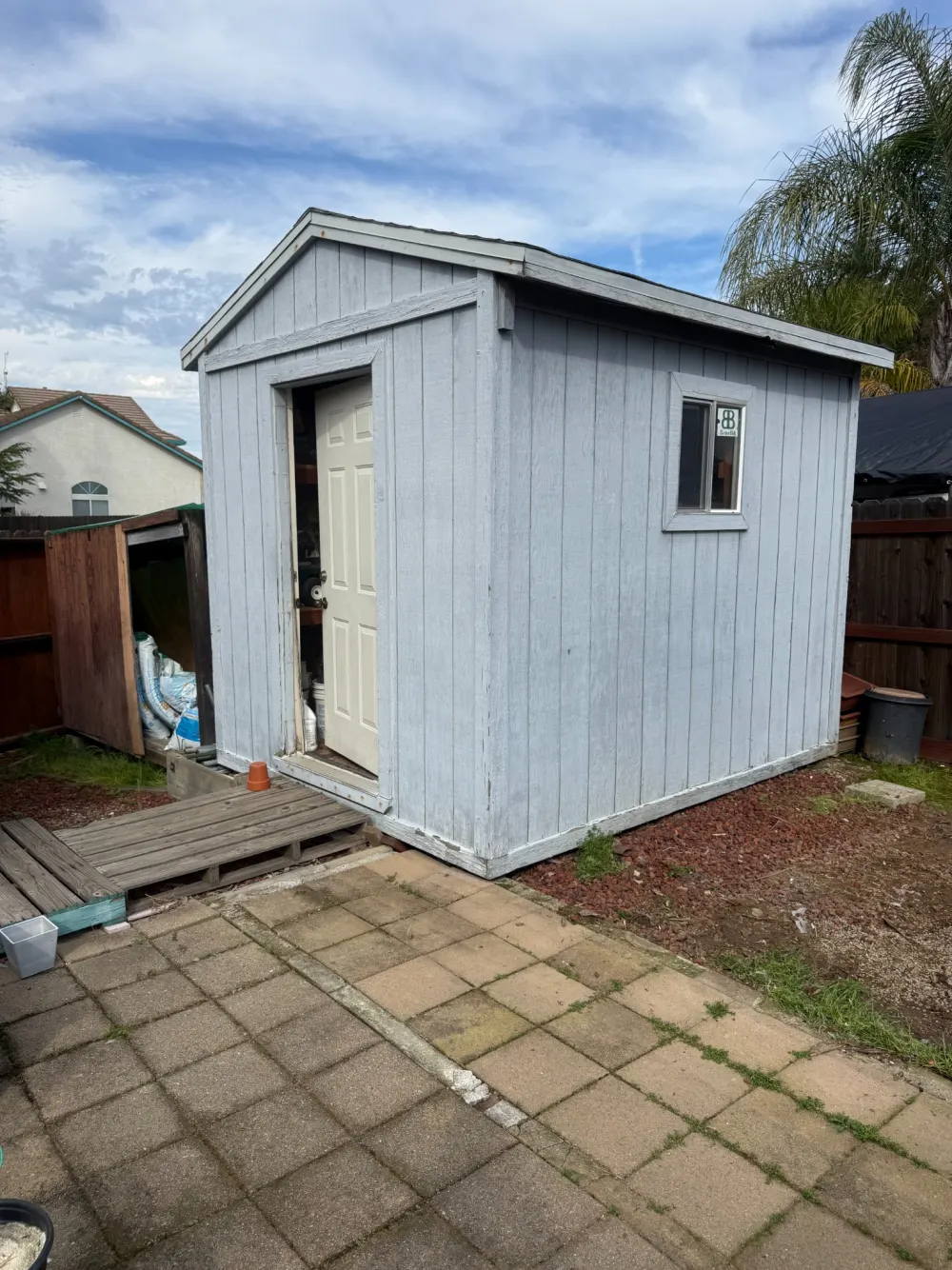 Wooden shed before removal by Way 2 Haul