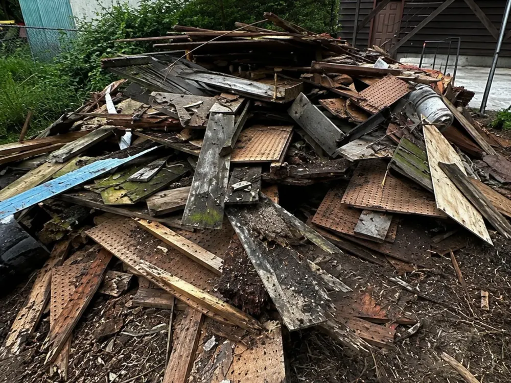Material staged shed removal — reference photo published by Flying Flamingo Junk Removal